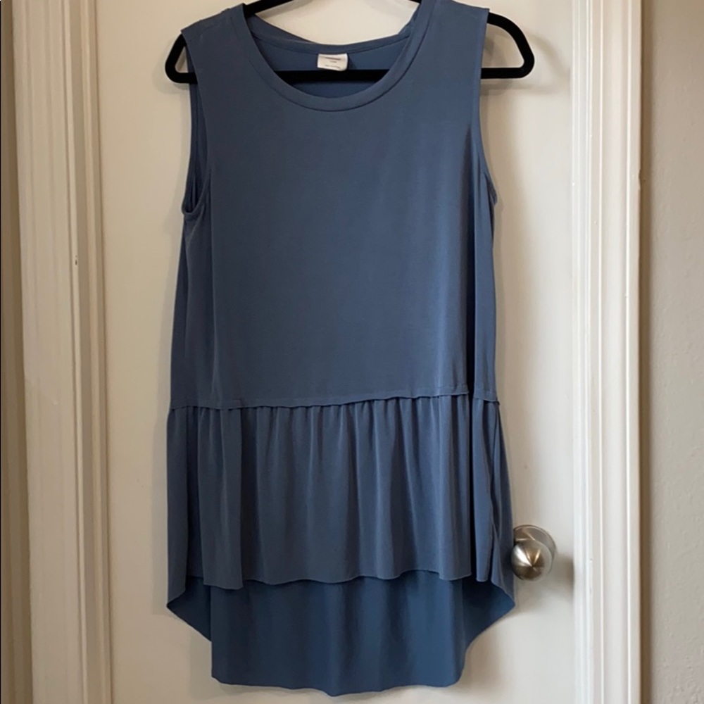 Hi-low sleeveless top with ruffled hemline